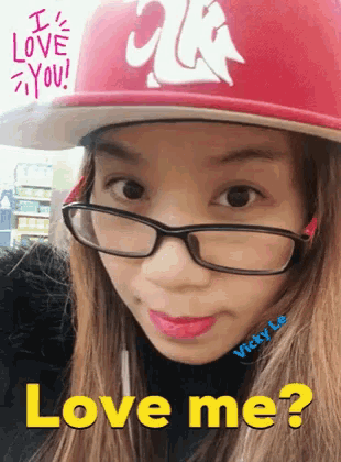a girl wearing glasses and a red hat says love me