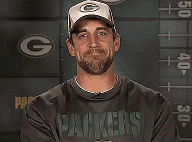 a man wearing a green bay packers shirt
