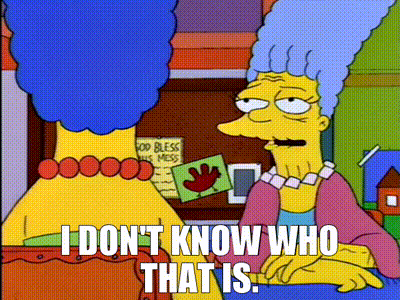 a cartoon character from the simpsons is sitting next to another cartoon character .