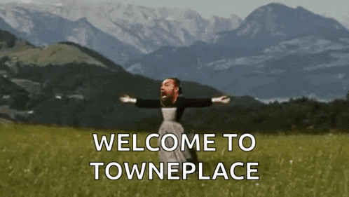 a man with his arms outstretched in a field with the words welcome to towneplace