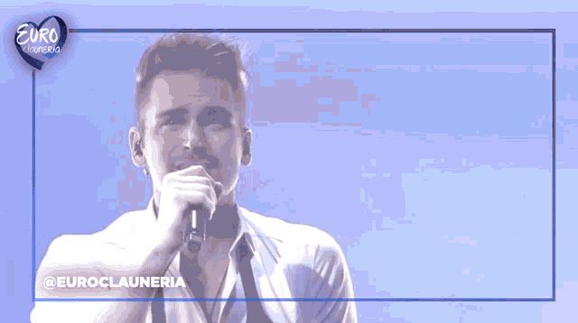 a man singing into a microphone with the word euro on the bottom right