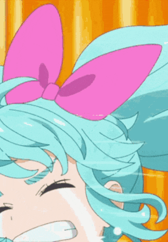 a girl with a pink bow on her head is crying