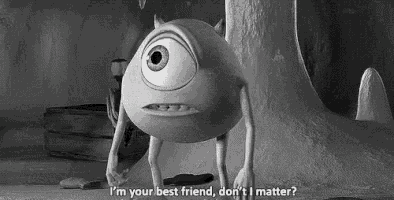 mike wazowski from monsters inc is standing next to a tree in a black and white photo with a quote .