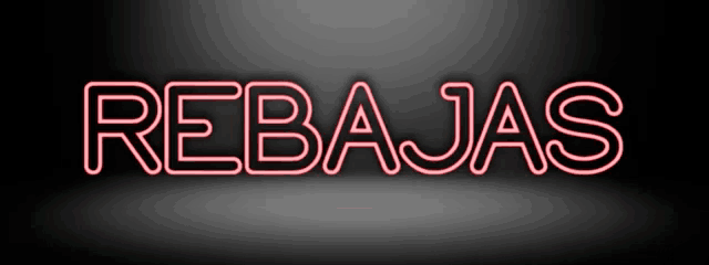 a neon sign that says rebajas in red on a black background