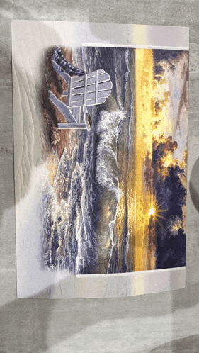 a painting of a chair on a beach with the sun shining through the clouds