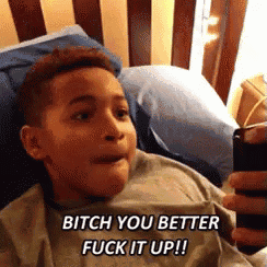 a young boy is laying on a bed and taking a selfie with the words bitch you better fuck it up