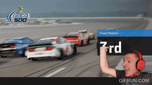a man wearing red headphones is watching a race with a sign that says 3rd