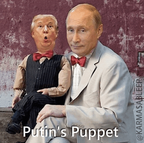 a man in a suit is sitting next to a puppet with the caption " putin 's puppet "