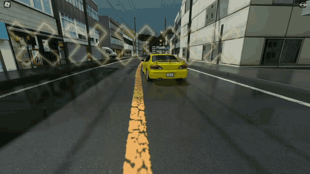a yellow car is driving down a street with a yellow line in the middle