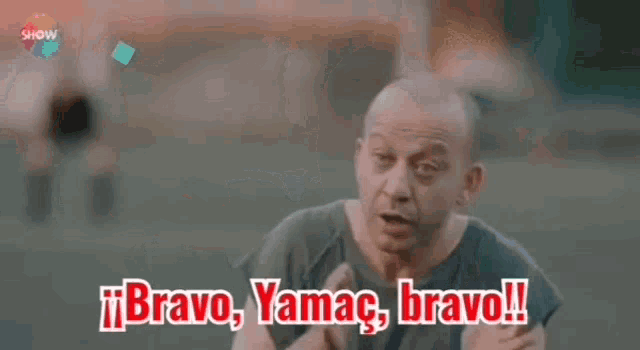 a man with his arms outstretched says bravo yamac bravo !!