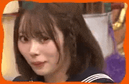 a close up of a woman 's face with an orange frame around her