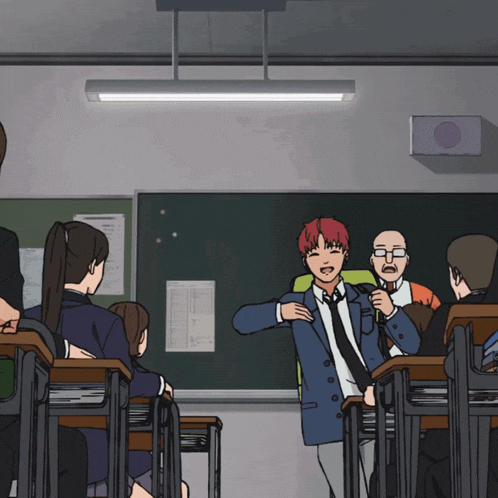 a man with red hair is standing in front of a classroom full of people