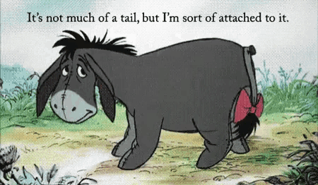 eeyore from winnie the pooh has a red bow in his tail