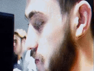 a pixelated image of a man looking at something