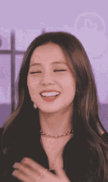 a close up of a woman with her eyes closed