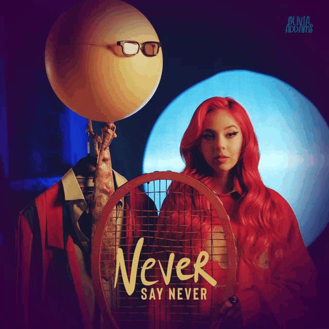 a woman with red hair is holding a tennis racquet on the cover of never say never