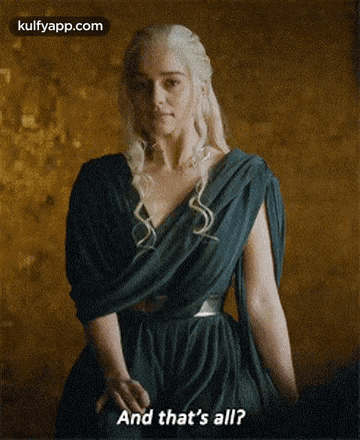 a woman in a green dress is standing in front of a wall and says and that 's all .