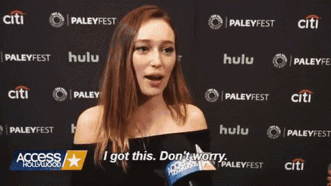 a woman is smiling and talking into a microphone at the paley fest