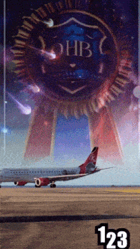 a plane is sitting on a runway in front of a sign that says ohb on it