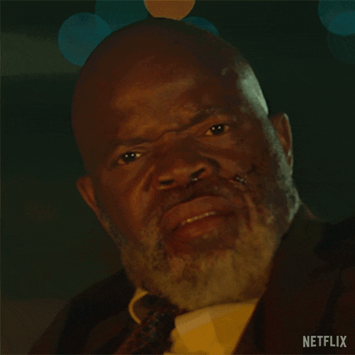 a close up of a man 's face with the word netflix on the bottom