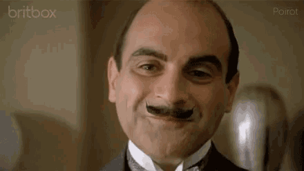 Smile Poirot GIF - Smile Poirot Smirk GIFs