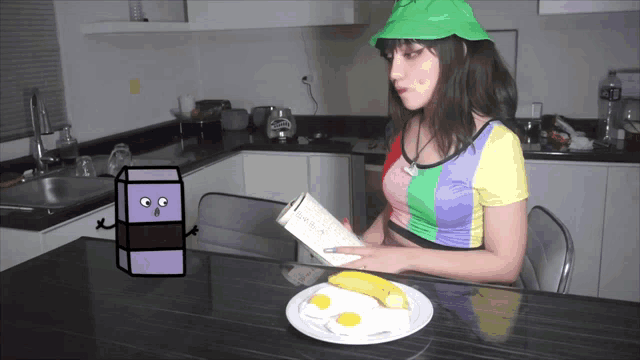 a woman sitting at a table reading a book next to a plate of eggs