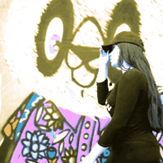 a woman stands in front of a wall with graffiti on it that says ' gsa '