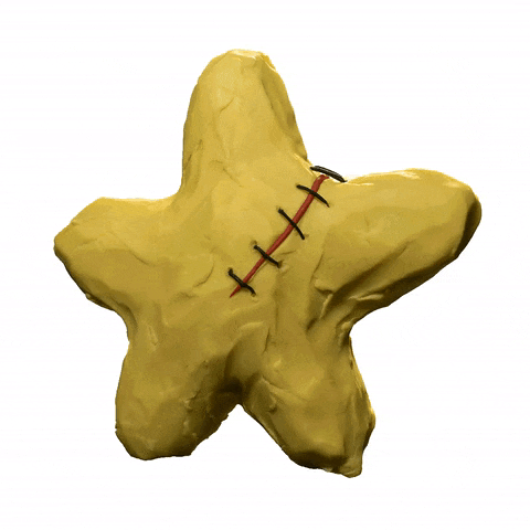 a yellow star with stitches on it is against a white background