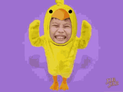 a person is wearing a yellow duck costume with their face on it