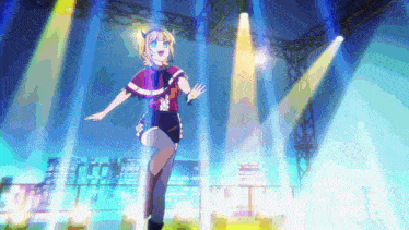 a girl with blonde hair is standing in front of a stage
