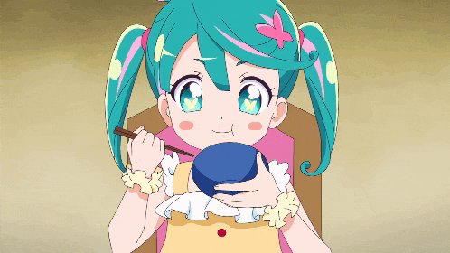 a little girl with pigtails is holding a blue bowl and chopsticks