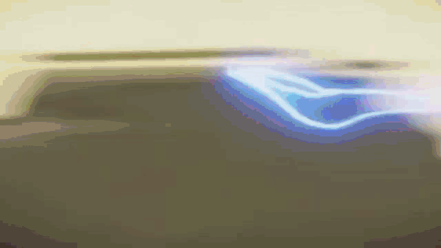 a dark background with a blue light coming out of the top