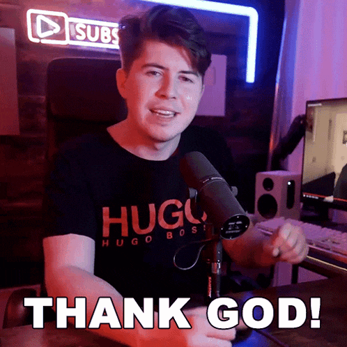 a man in a hugo boss shirt is giving a thumbs up