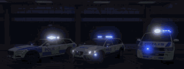 four police cars are parked in a dark parking garage