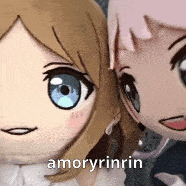 two dolls are standing next to each other with the words amoryrinrin in the corner