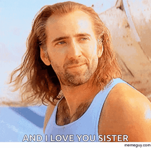 a man with long hair and a beard is smiling and says " and i love you sister "