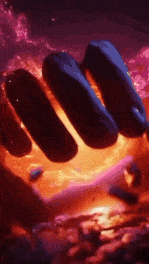 a close up of a person 's hand holding a blue object in a purple and red background .