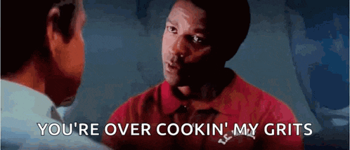 a man in a red shirt is talking to another man and says you 're over cookin my grits .