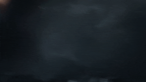 a helicopter is flying through a dark cave