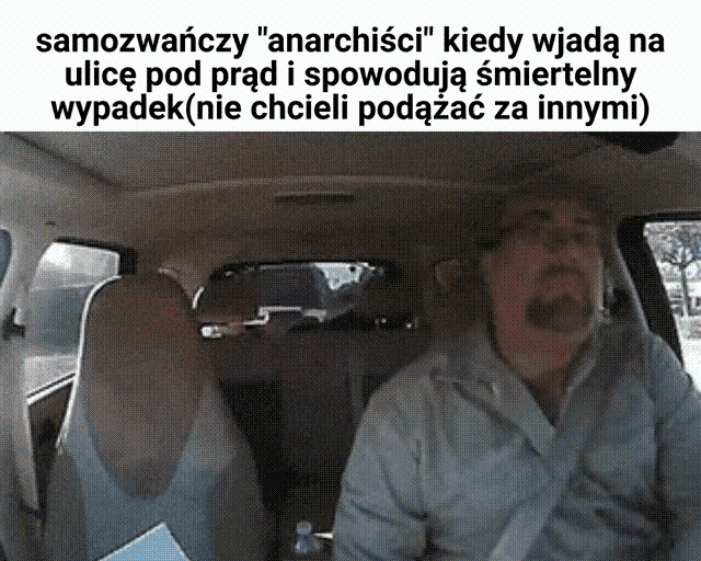 a man is sitting in the back seat of a car with a bottle of water next to him