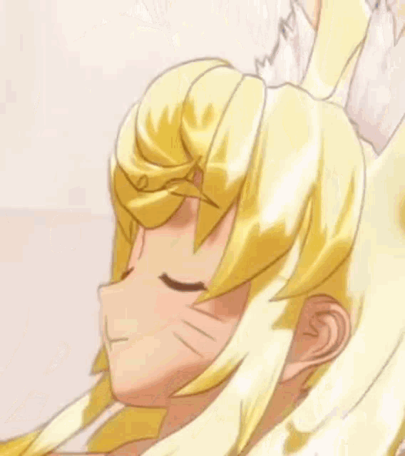 a close up of a girl with blonde hair and cat ears .