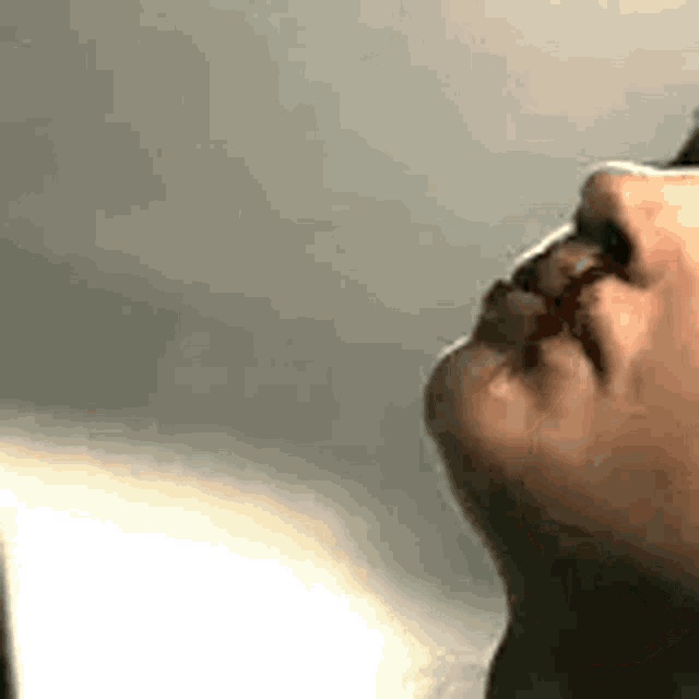 a close up of a person 's mouth with blood coming out of it .