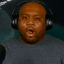 a man wearing headphones is making a funny face .