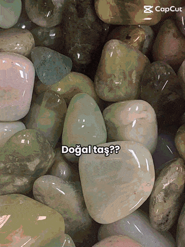 a pile of rocks with a caption that says dogal taş