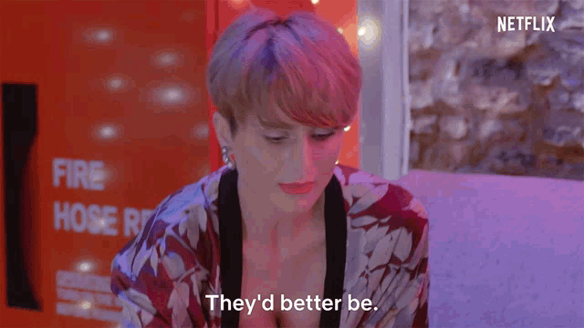 a woman says they 'd better be in front of a netflix logo