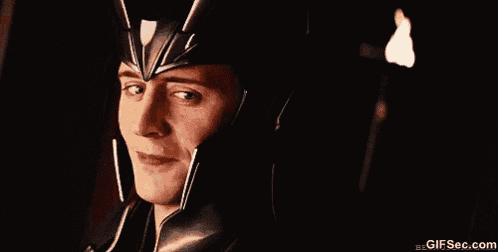 a close up of a man wearing a helmet smiling .