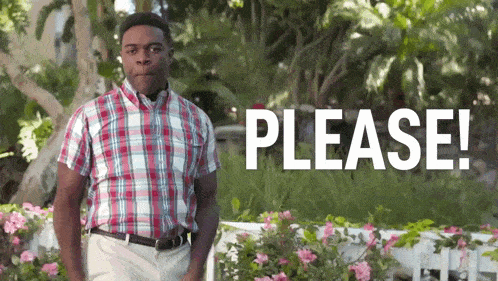 a man in a plaid shirt is standing in front of flowers and a sign that says `` please '' .