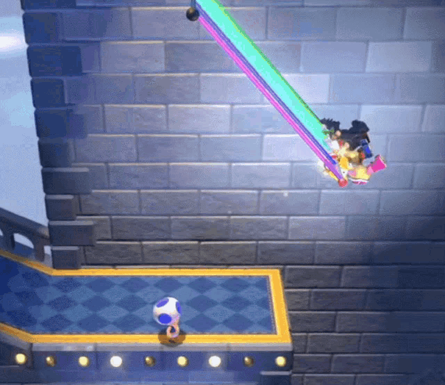 a video game is being played on a brick wall with a blue checkered floor
