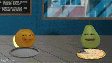 a pear and an orange are standing next to a pizza on a table