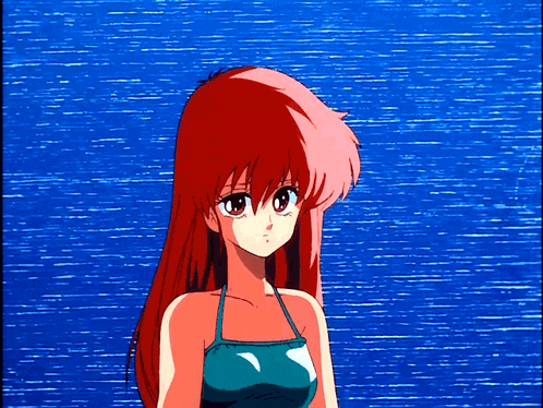 a girl with red hair is standing in front of a blue ocean